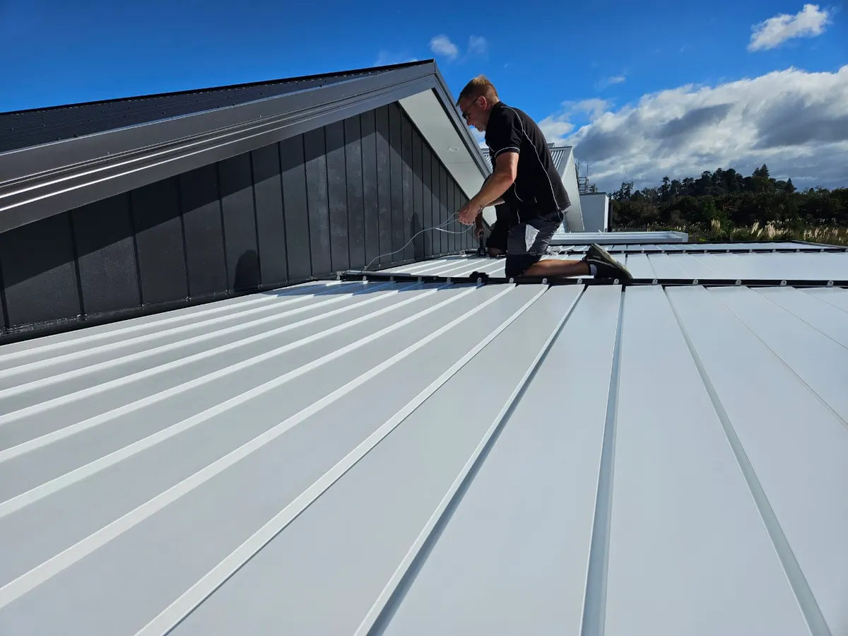 Installer fixing roofing on site