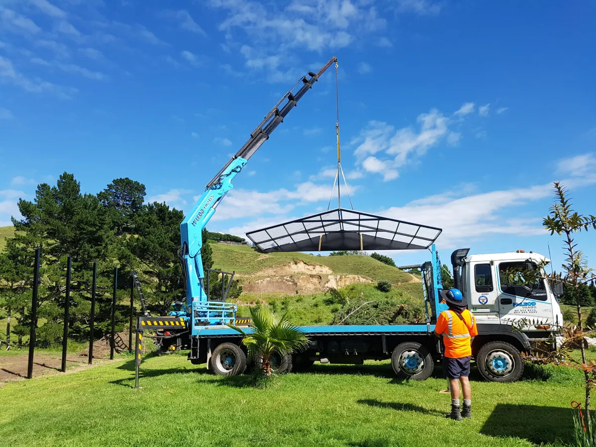 Matrix team installing a pergola frame with a crane truck